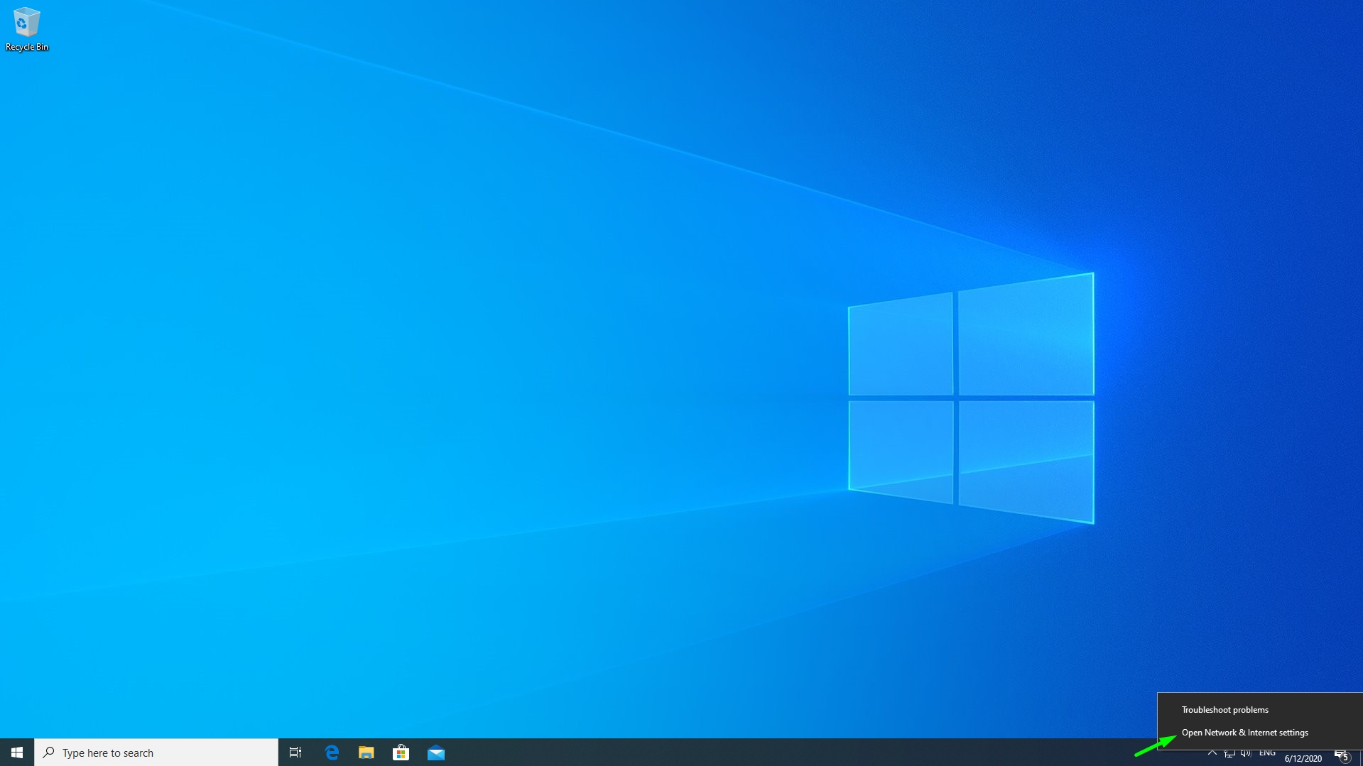 Screenshot of the standard Windows 10 Desktop indicating settings in lower right corner
